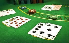 nemo Gaple app interface on mobile phone showing domino hand and dealer dominoes
